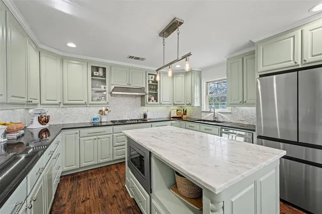 a bedroom with furniture a rug and a window