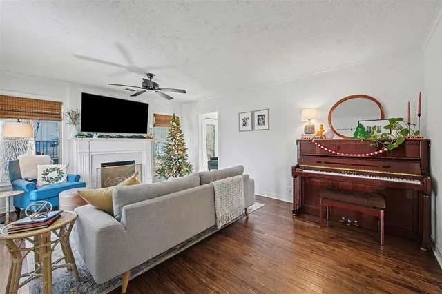 a view of a dining room with furniture wooden floor and chandelier