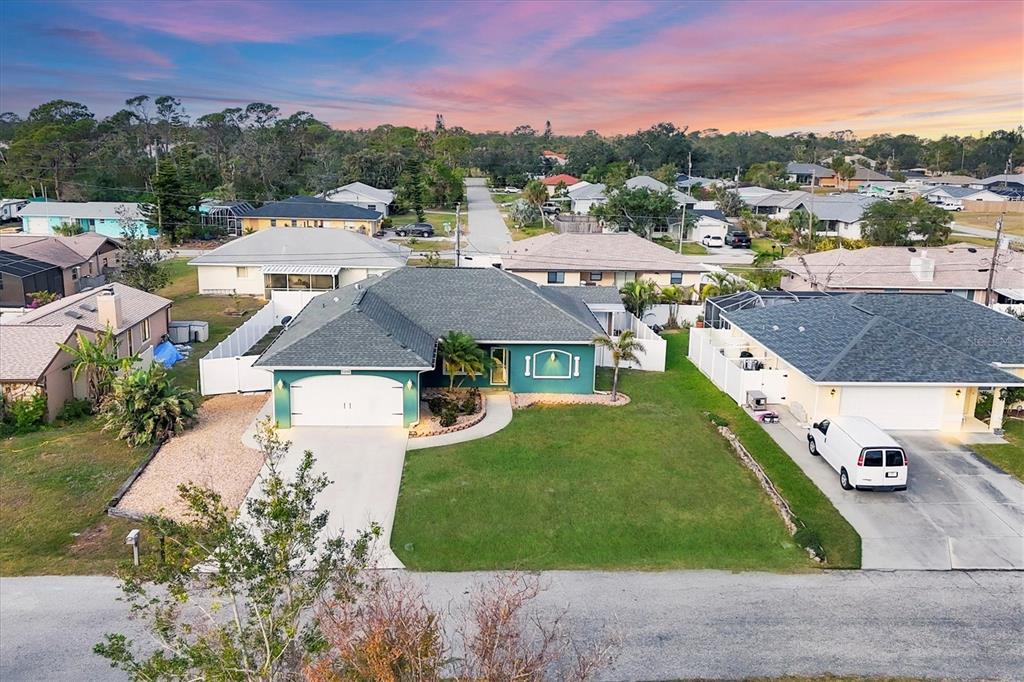 5298 Drew Road Venice, FL 34293 - Photo 1 of 1 an aerial view of residential houses with outdoor space and trees