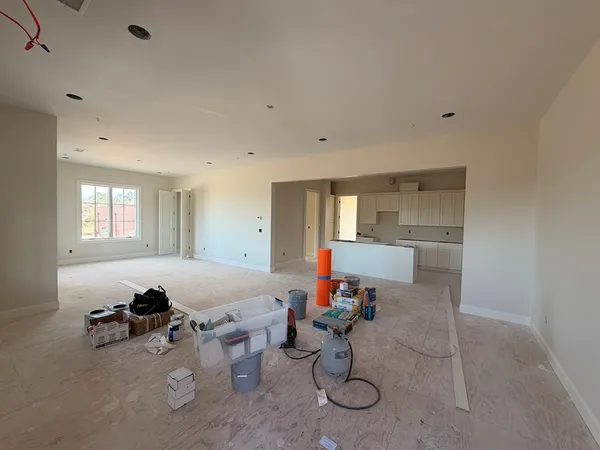 a room with furniture a rug and a window