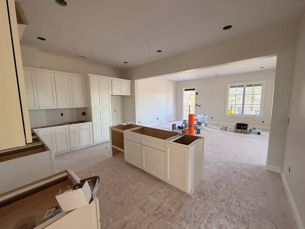 6801 River Road, Unit 407 Columbus, GA 31904 - Photo 4 of 8 a kitchen with stainless steel appliances a stove a sink and a refrigerator