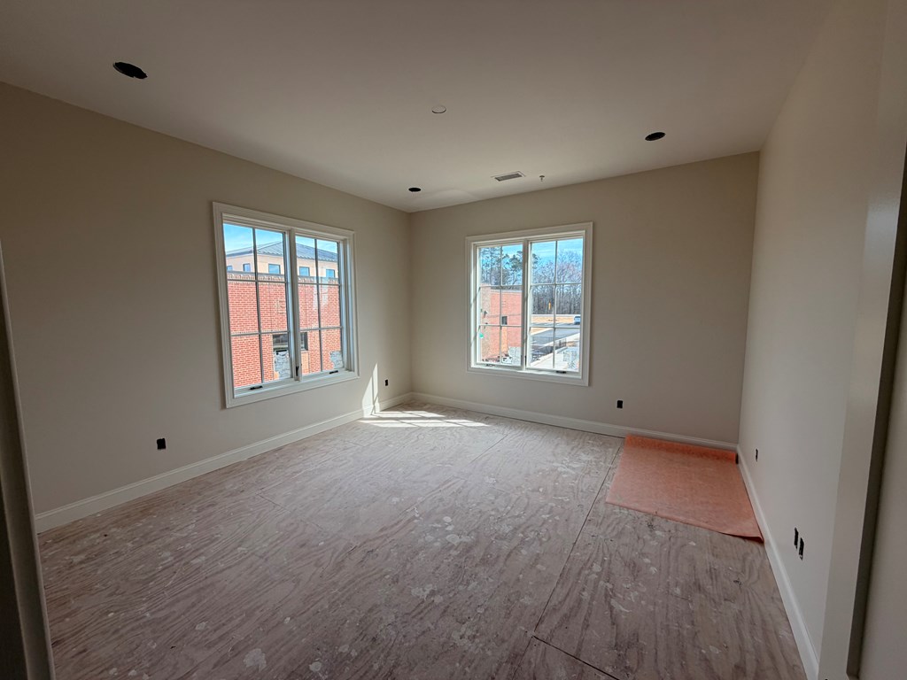 6801 River Road, Unit 407 Columbus, GA 31904 - Photo 6 of 8 an empty room with windows