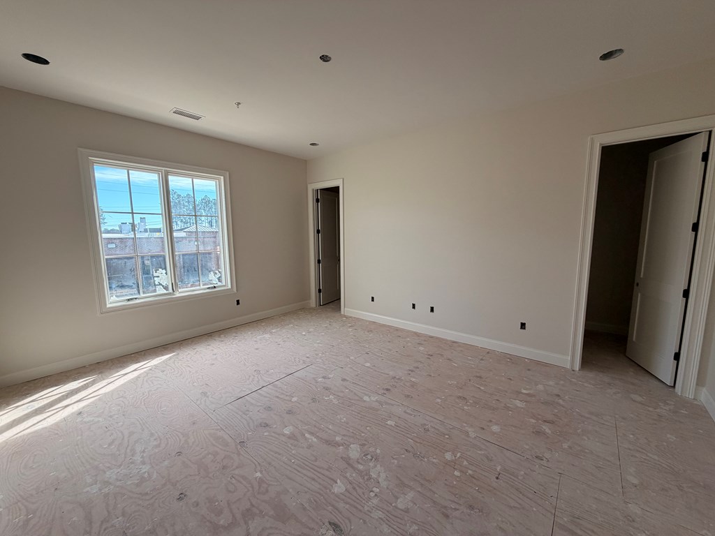 6801 River Road, Unit 407 Columbus, GA 31904 - Photo 8 of 8 a view of an empty room with a window