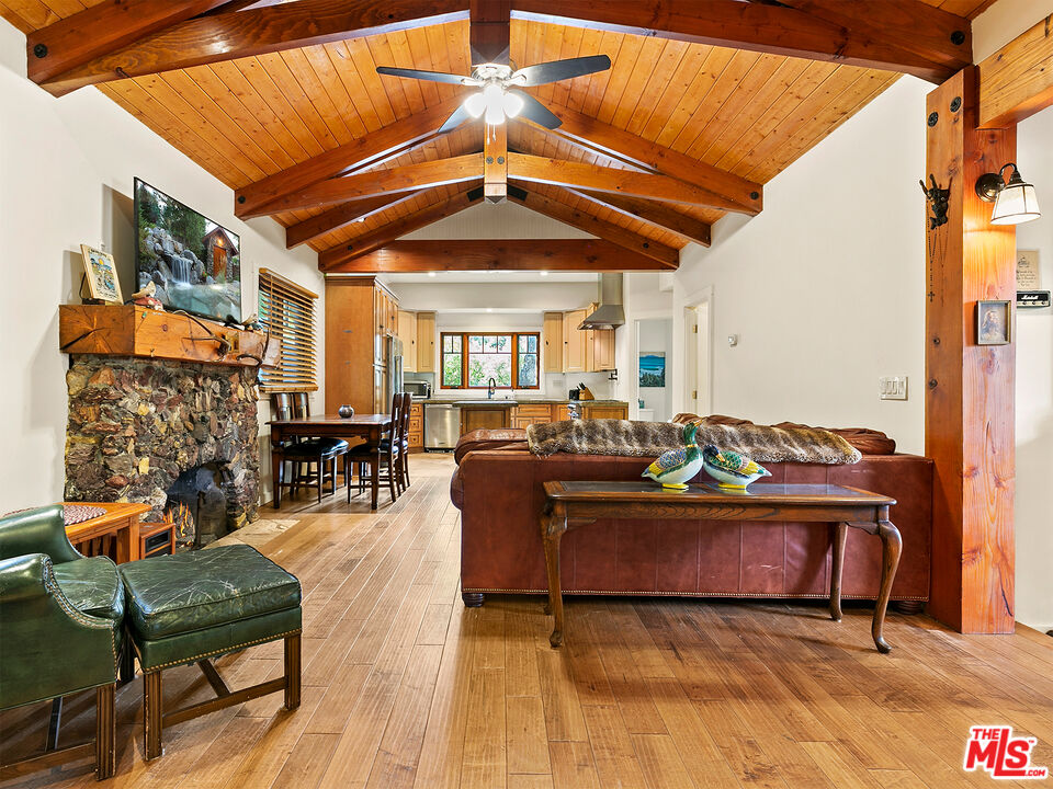 25643 Timpangos Drive Monte Nido, CA 91302 - Photo 11 of 24 a living room with furniture and a chandelier