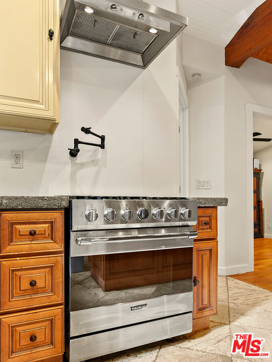 25643 Timpangos Drive Monte Nido, CA 91302 - Photo 17 of 24 a stove top oven sitting inside of a kitchen