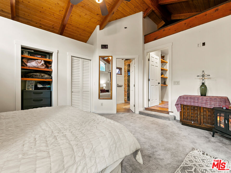 25643 Timpangos Drive Monte Nido, CA 91302 - Photo 20 of 24 a bedroom with a bed and a dresser