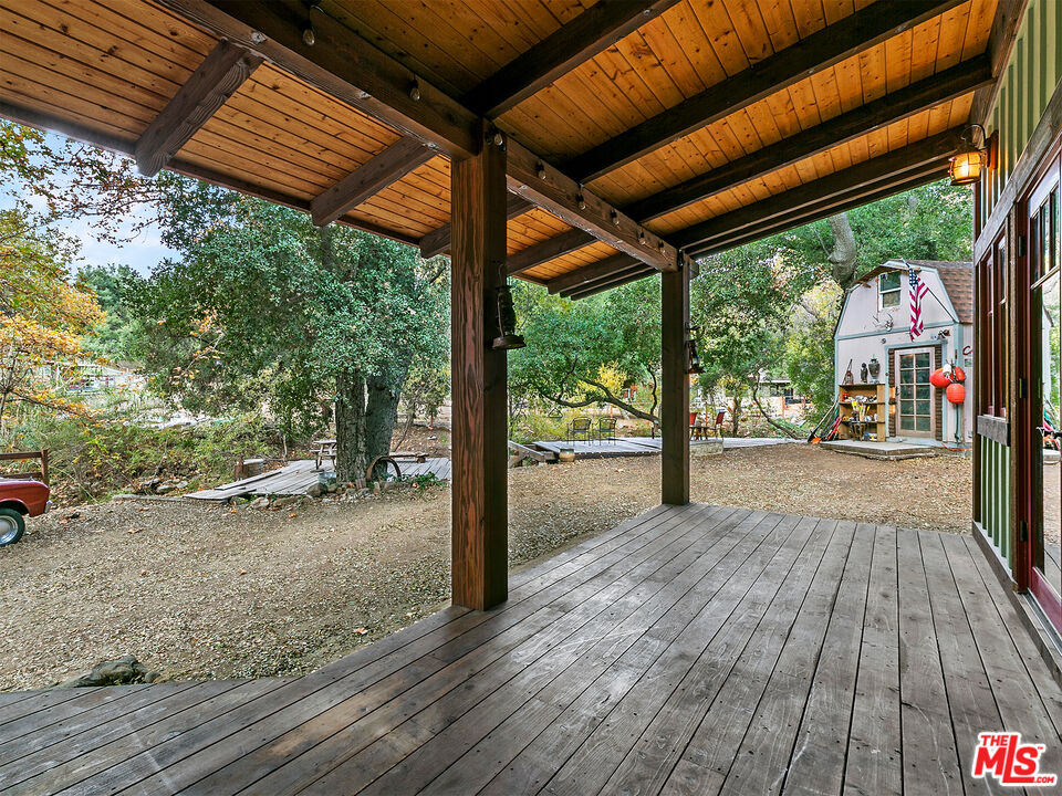 25643 Timpangos Drive Monte Nido, CA 91302 - Photo 9 of 24 a view of a room with wooden floor and roof