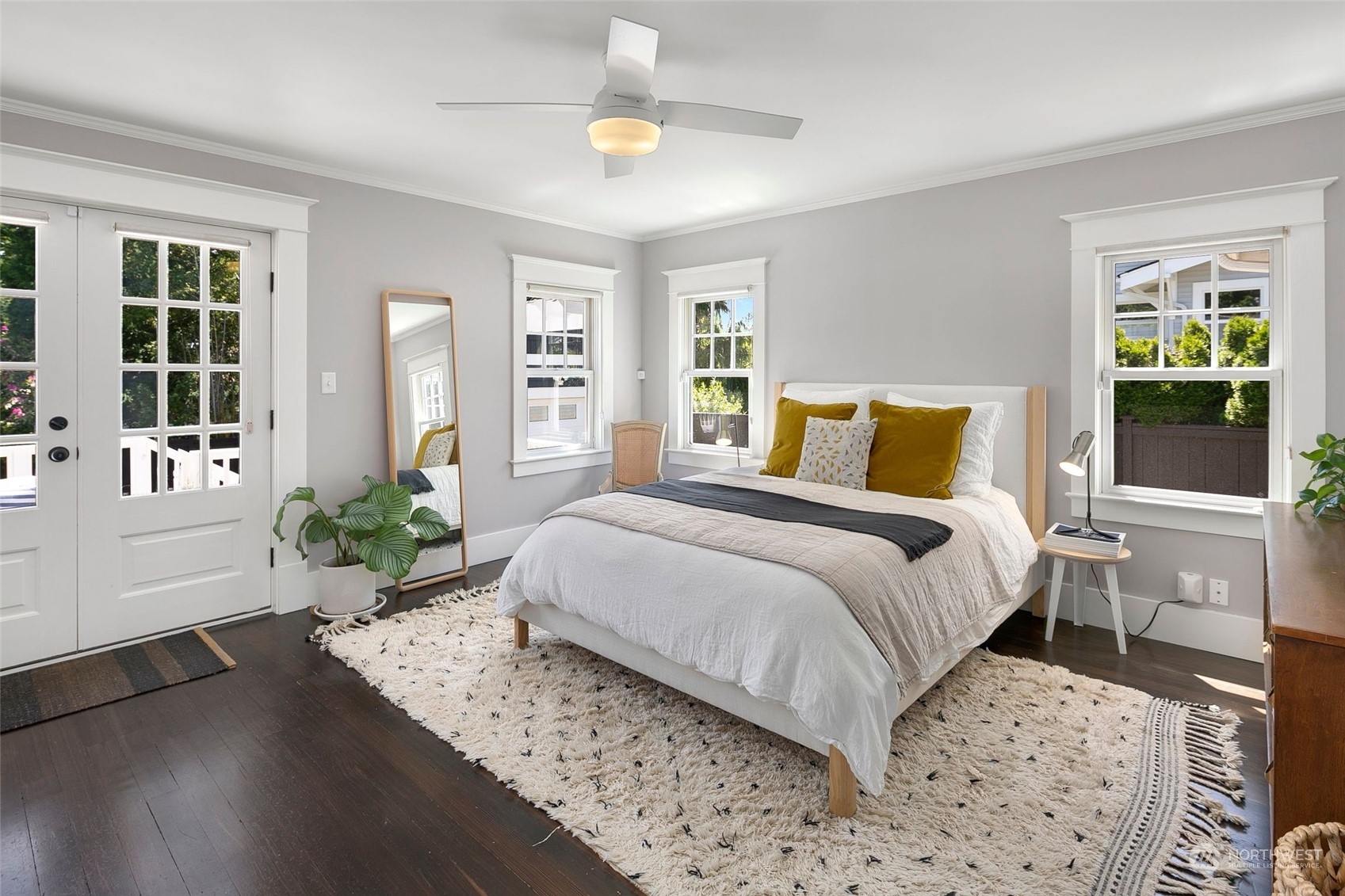 3244 Walnut Avenue Southwest Seattle, WA 98116 - Photo 13 of 40 a bedroom with a large bed and a potted plant