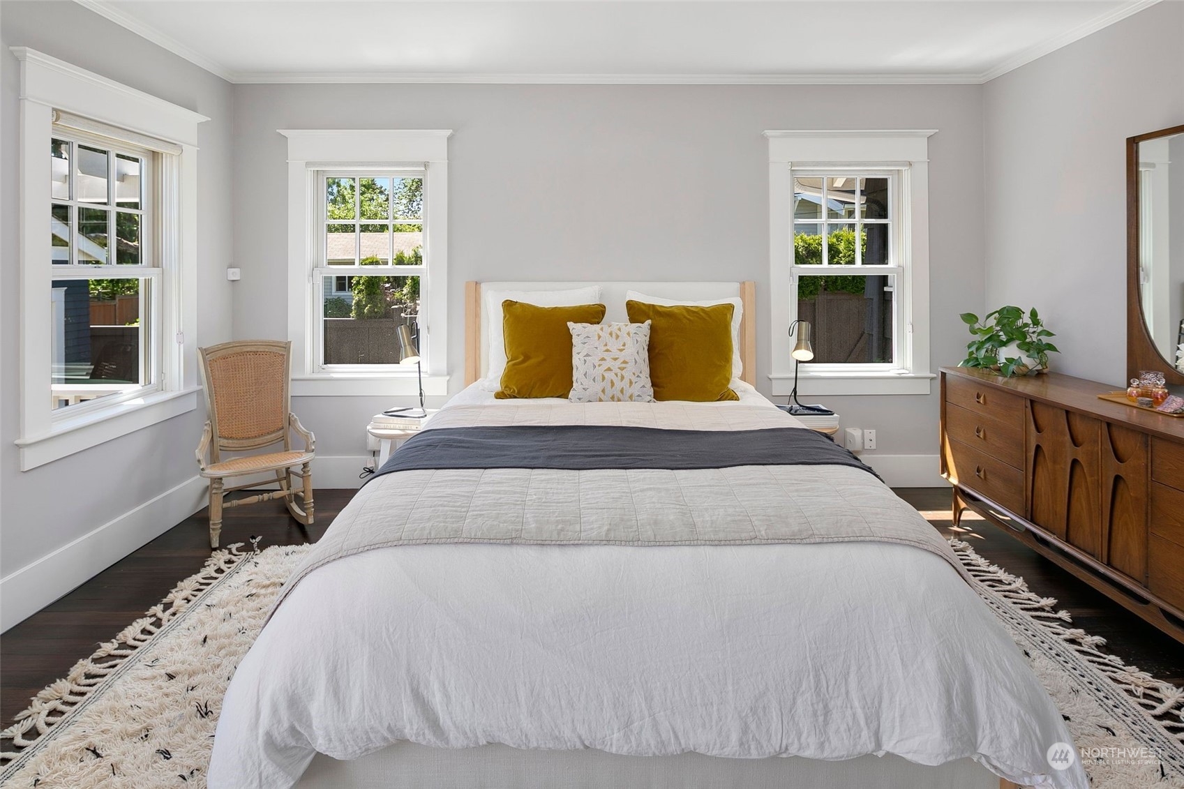 3244 Walnut Avenue Southwest Seattle, WA 98116 - Photo 14 of 40 a bedroom with a large bed and a window