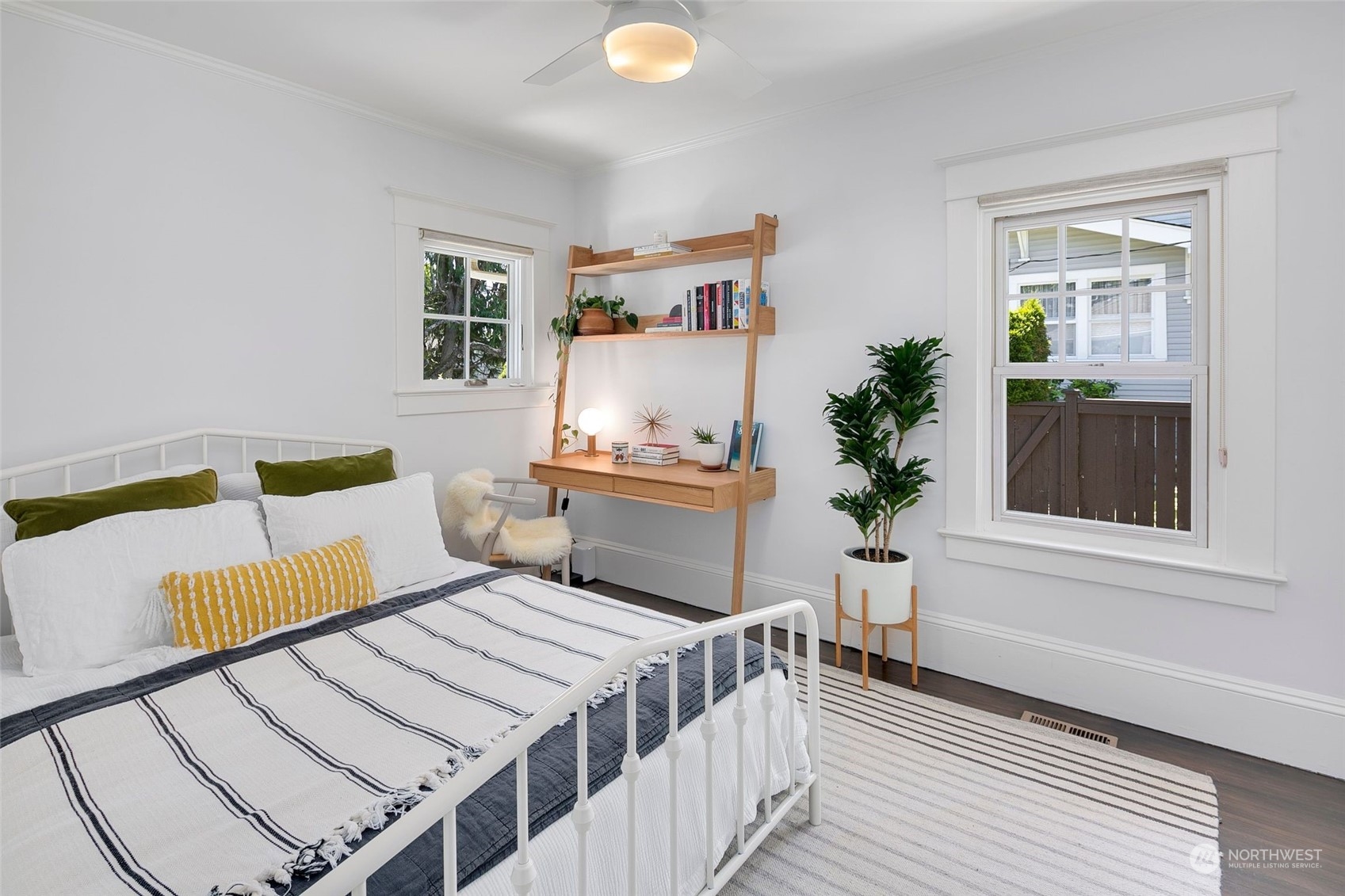3244 Walnut Avenue Southwest Seattle, WA 98116 - Photo 17 of 40 a bedroom with a bed and a potted plant