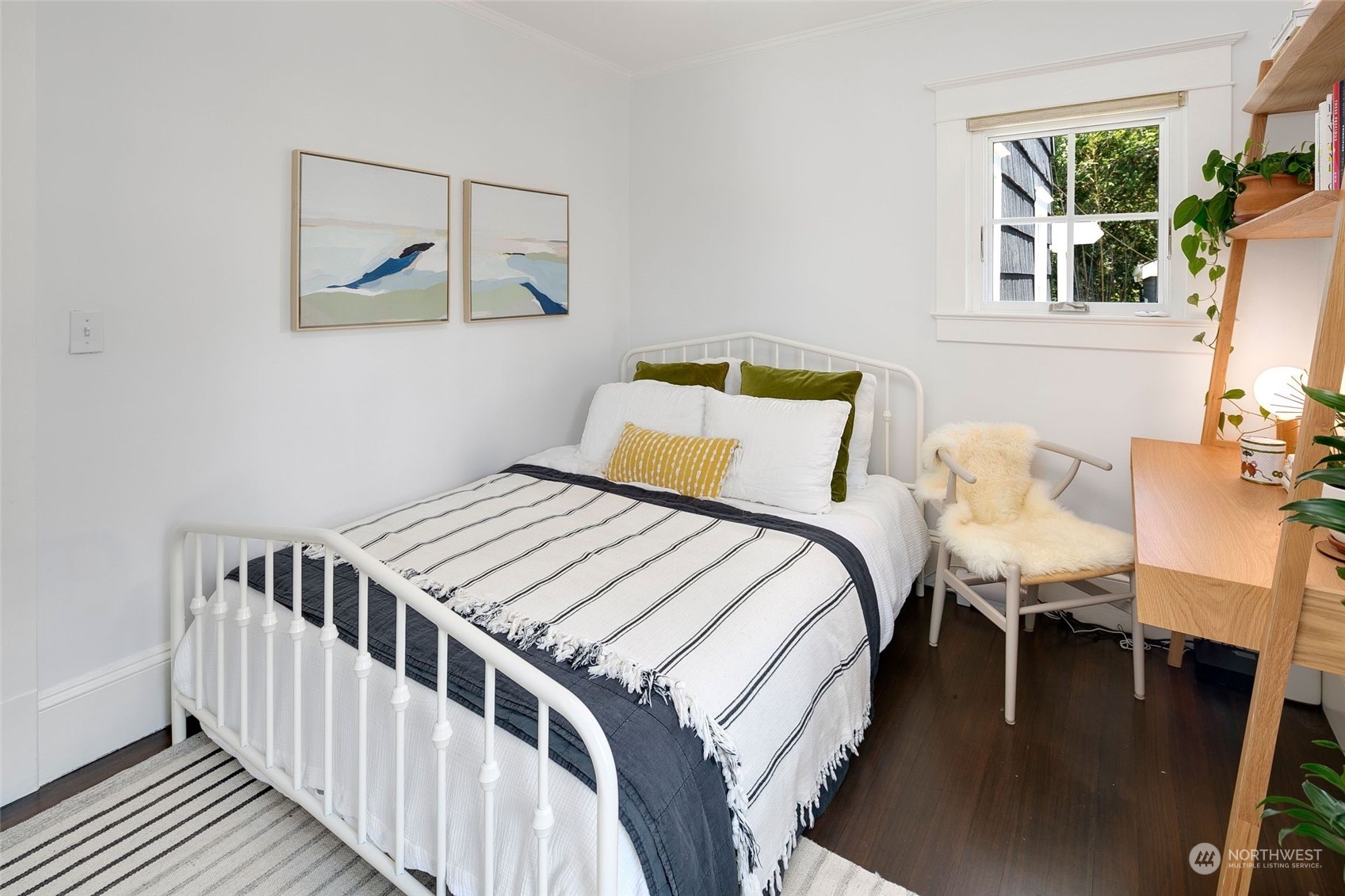 3244 Walnut Avenue Southwest Seattle, WA 98116 - Photo 18 of 40 a bedroom with a bed and a window