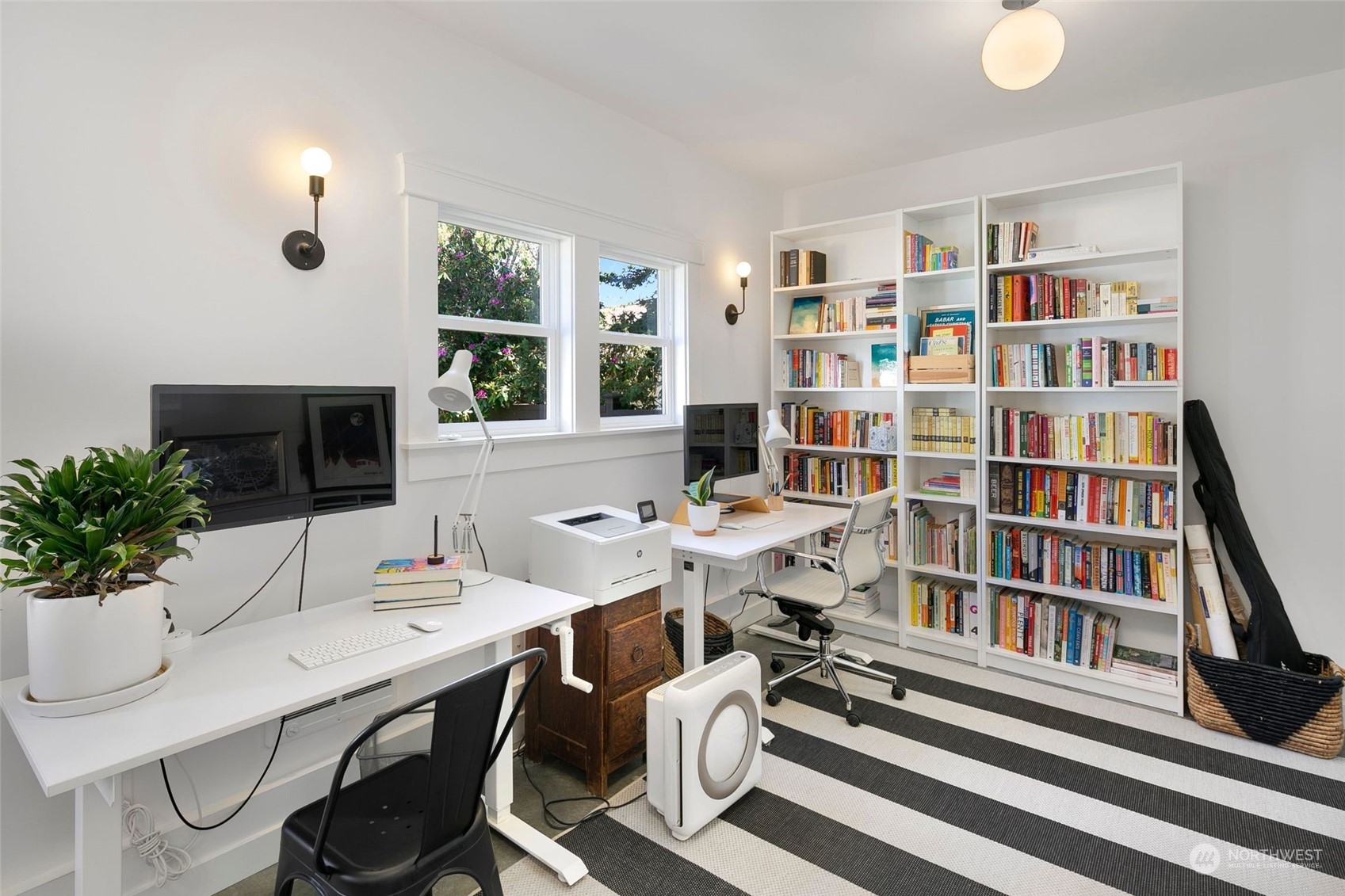 3244 Walnut Avenue Southwest Seattle, WA 98116 - Photo 25 of 40 a work room with furniture potted plant and a book shelf