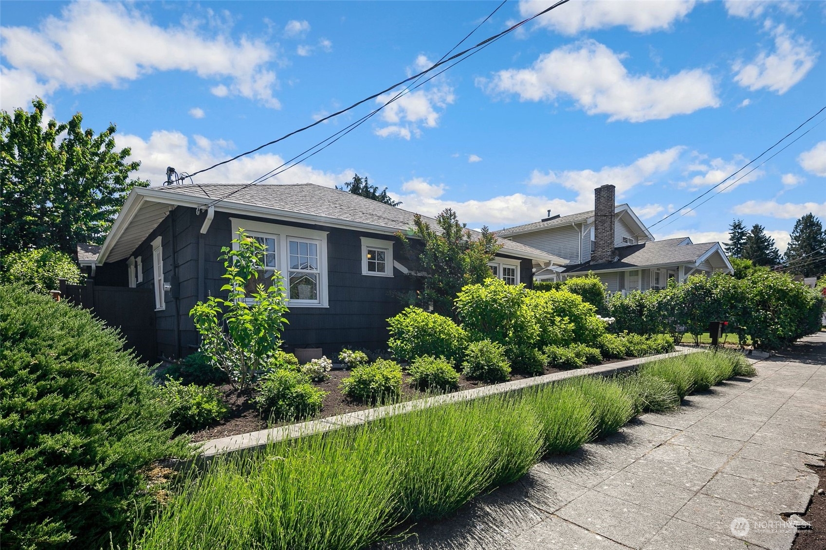 3244 Walnut Avenue Southwest Seattle, WA 98116 - Photo 33 of 40 a front view of a house with a yard