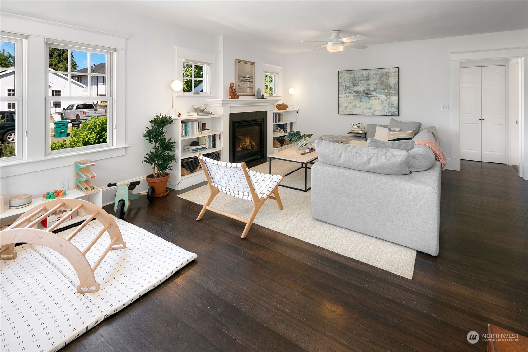 3244 Walnut Avenue Southwest Seattle, WA 98116 - Photo 9 of 40 a living room with furniture and a fireplace