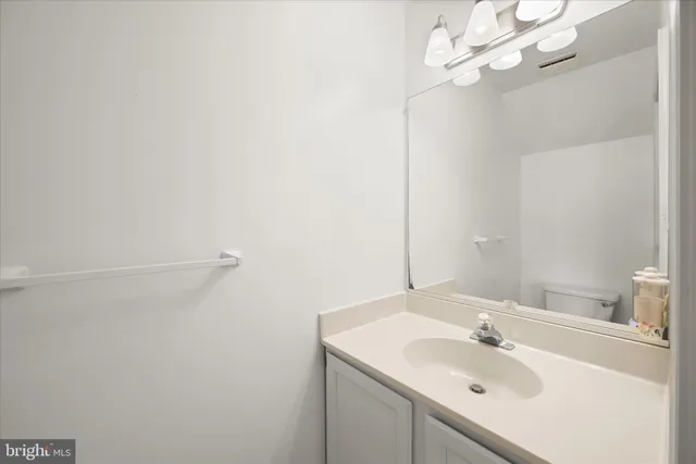 a living room with furniture and a dresser