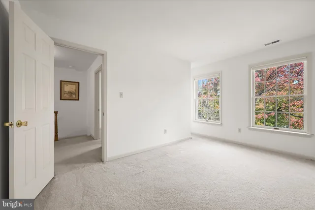 a bathroom with a sink toilet a mirror and shower