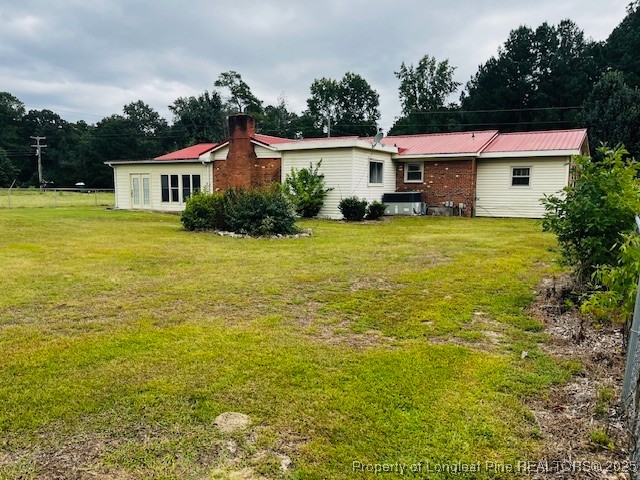 4141 Locks Creek Church Road Fayetteville, NC 28312 - Photo 2 of 23 a front view of house with yard and trees