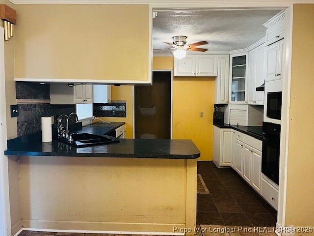 4141 Locks Creek Church Road Fayetteville, NC 28312 - Photo 5 of 23 a kitchen with stainless steel appliances granite countertop a refrigerator a stove and a sink with wooden floors