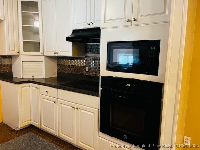 4141 Locks Creek Church Road Fayetteville, NC 28312 - Photo 6 of 23 a kitchen with granite countertop white cabinets and black appliances