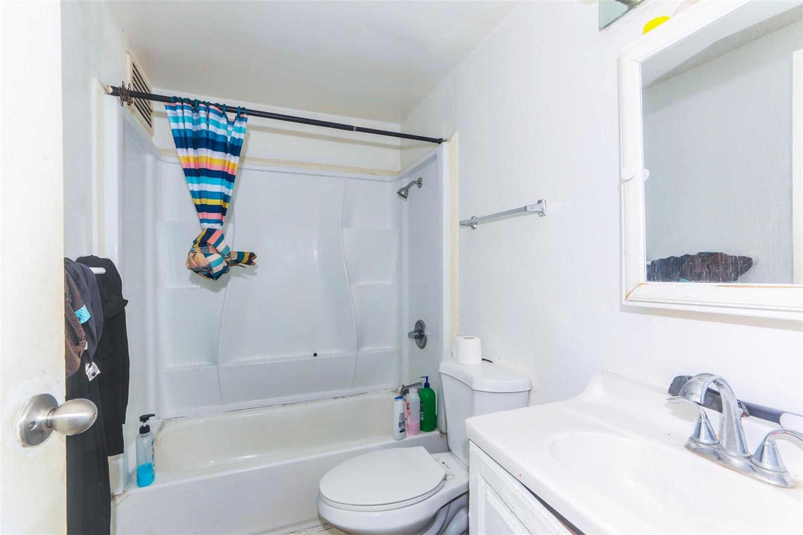 87-122 Helelua Street, Unit C103 Waianae, HI 96792 - Photo 5 of 12 a bathroom with a sink toilet and shower