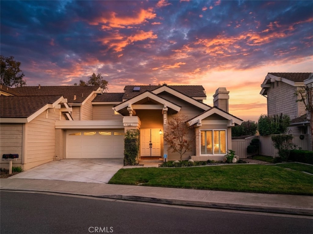 26 Windflower Irvine, CA 92603 - Photo 1 of 1 a front view of a house with a garden and plants