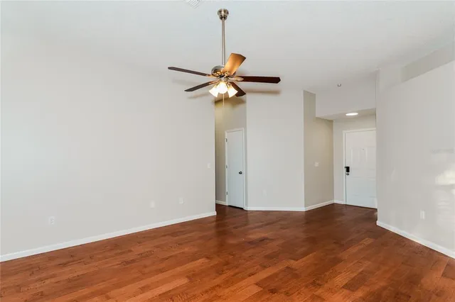 a view of a chandelier fan in a room
