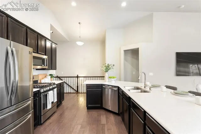 a dining room with furniture and wooden floor