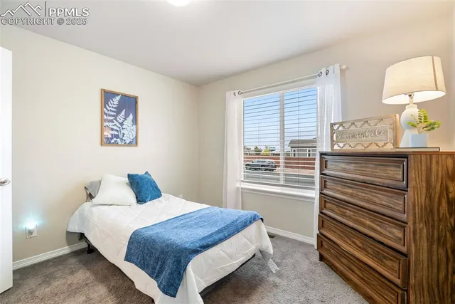 a bedroom with a bed and a dresser