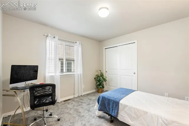 a view of a hallway with stairs and furniture
