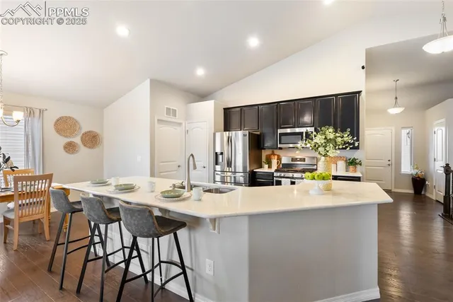 a living room with furniture and a table