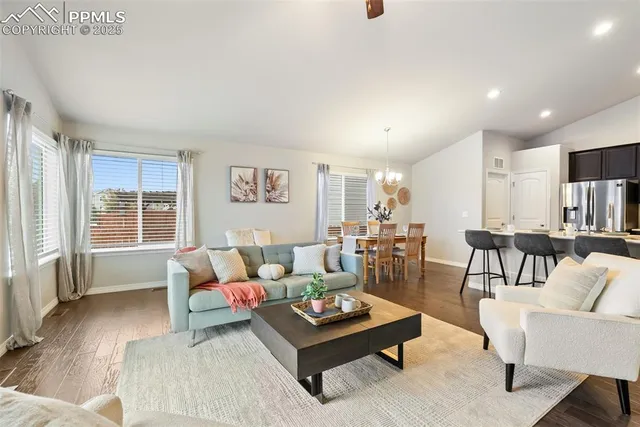 a large kitchen with a table and chairs