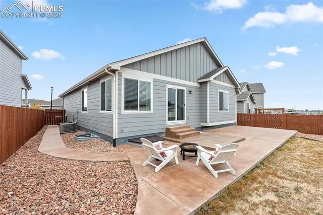 a bedroom with a bed and ceiling fan