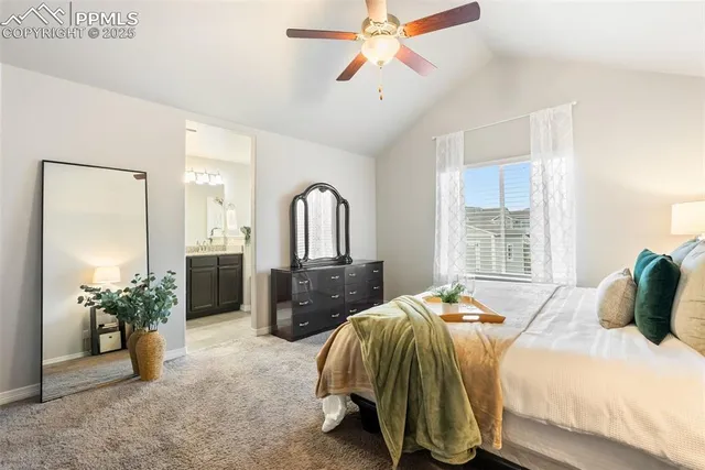 a bed room with bed and a chandelier