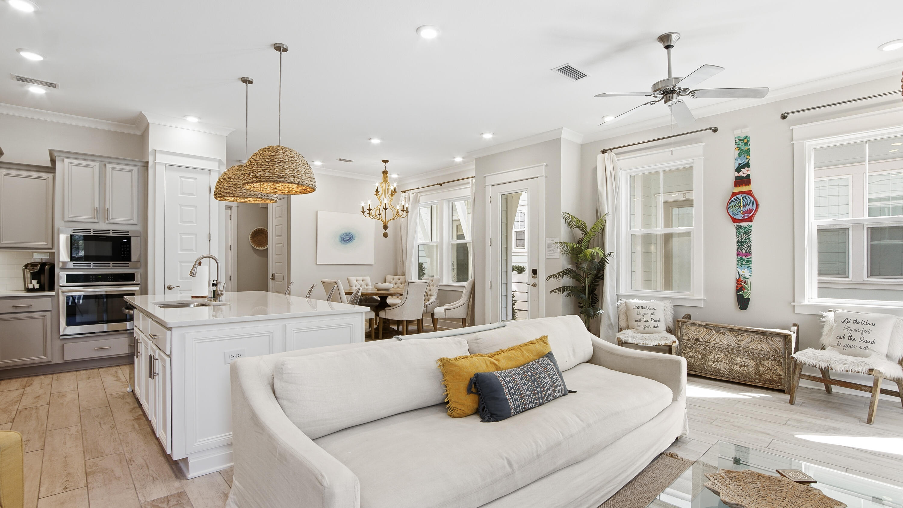 51 Dune Comet Lane, Unit A Inlet Beach, FL 32461 - Photo 11 of 41 a living room with furniture kitchen view and a chandelier
