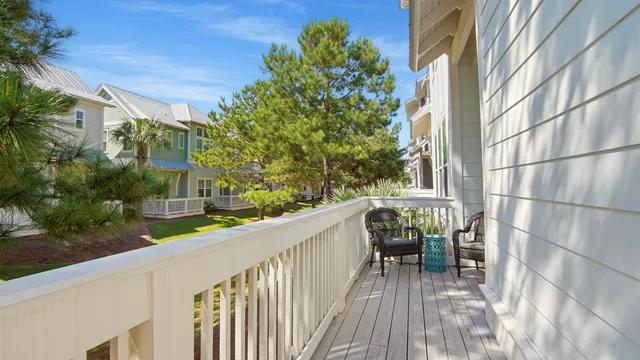 a view of a balcony with trees