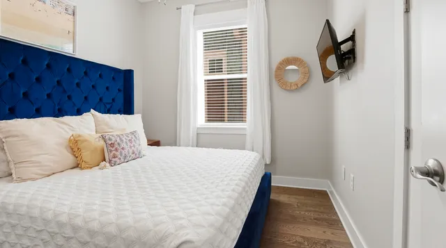 a bedroom with a bed and a closet