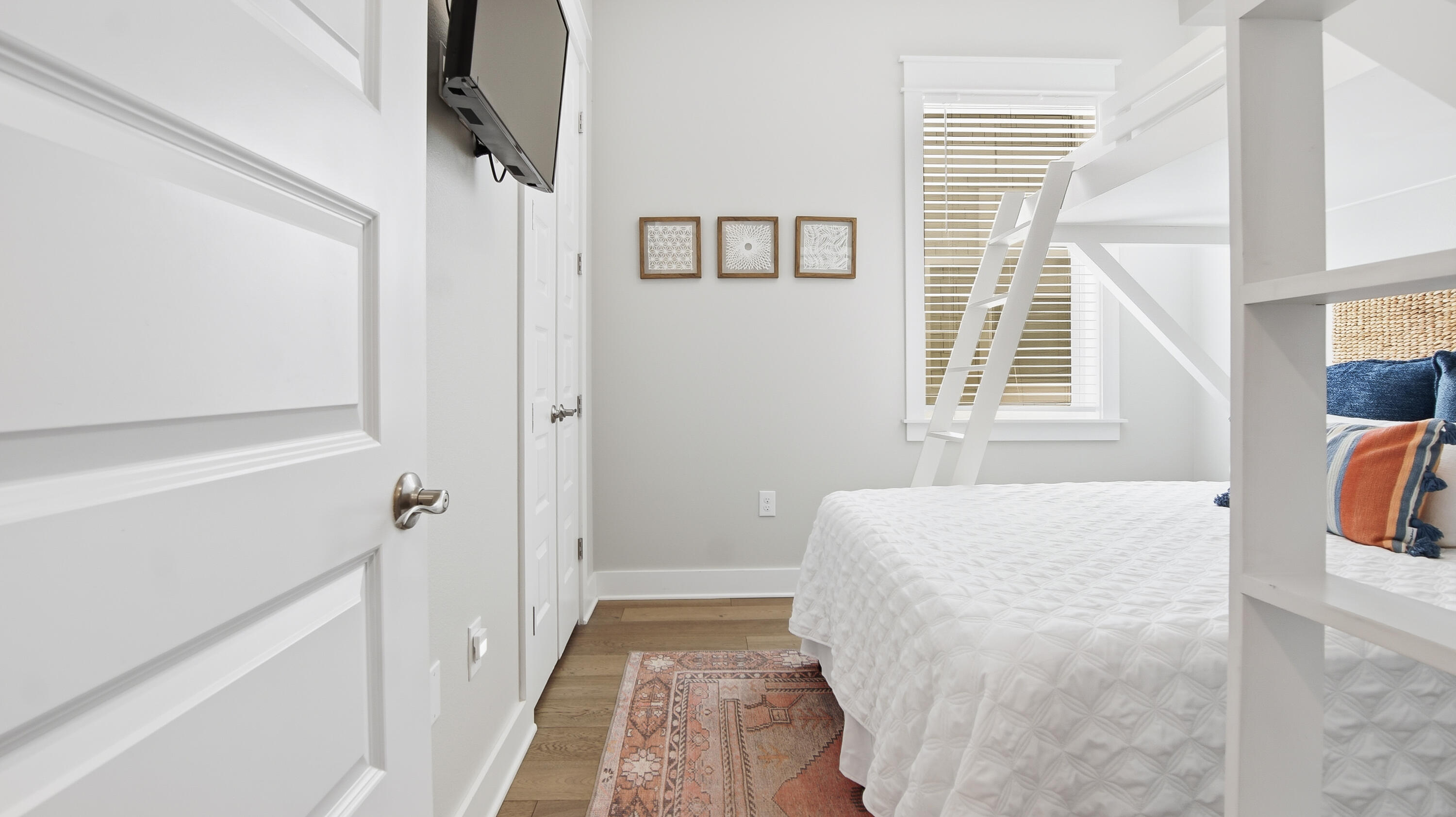 51 Dune Comet Lane, Unit A Inlet Beach, FL 32461 - Photo 20 of 41 a bedroom with a bed and a window with wooden floor