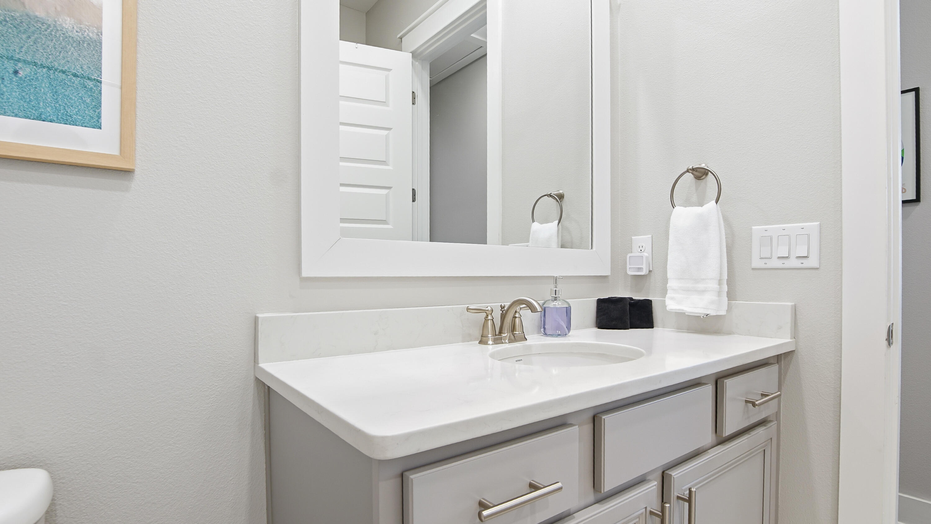 51 Dune Comet Lane, Unit A Inlet Beach, FL 32461 - Photo 24 of 41 a bathroom with a sink and a mirror