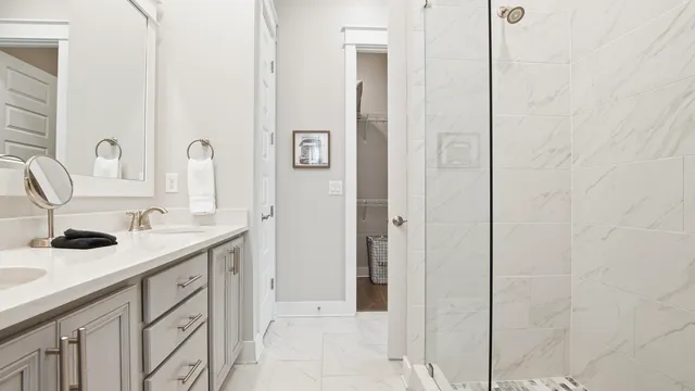 a bathroom with a shower and a sink