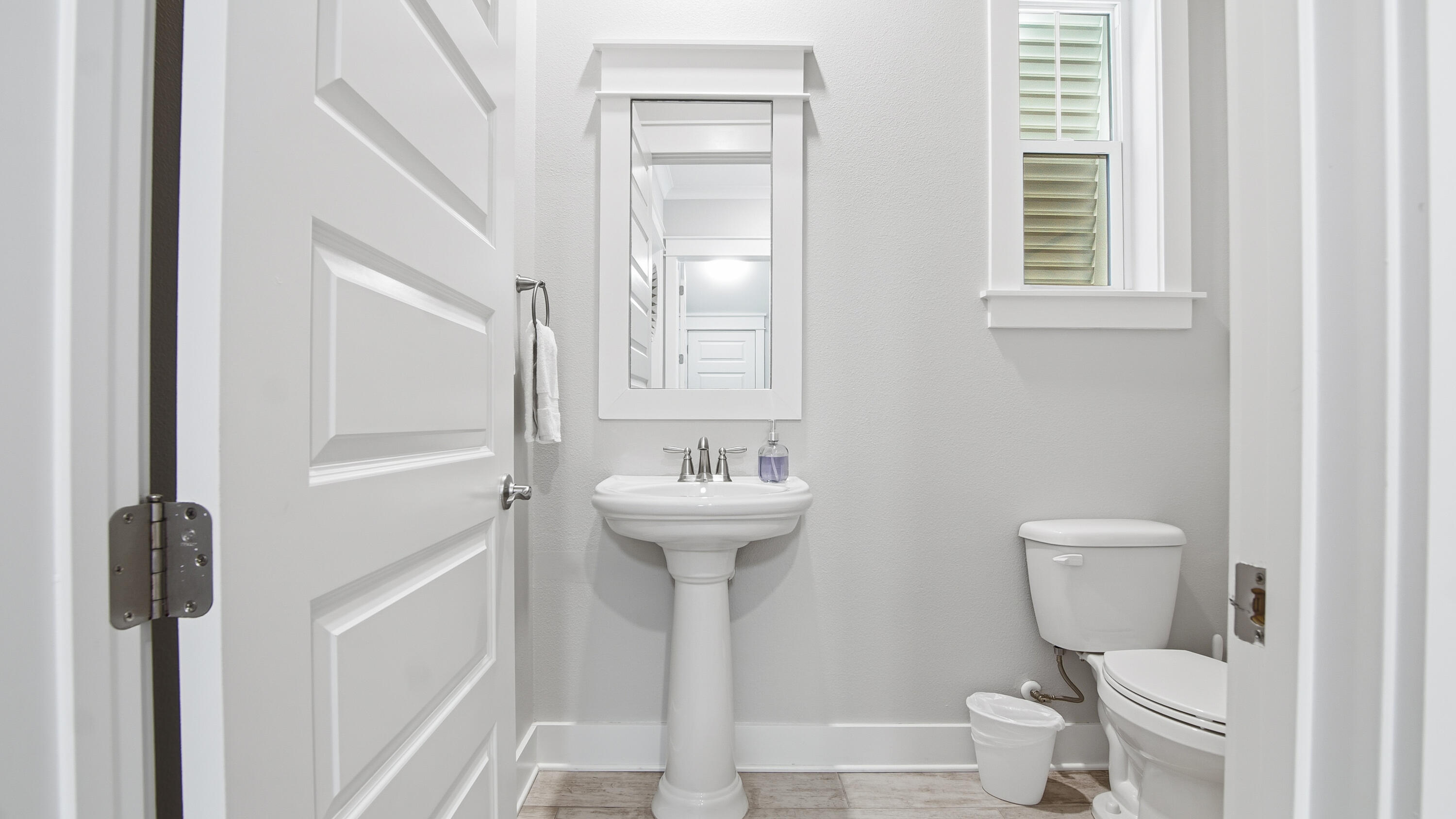 51 Dune Comet Lane, Unit A Inlet Beach, FL 32461 - Photo 32 of 41 a bathroom with a sink a toilet and a mirror