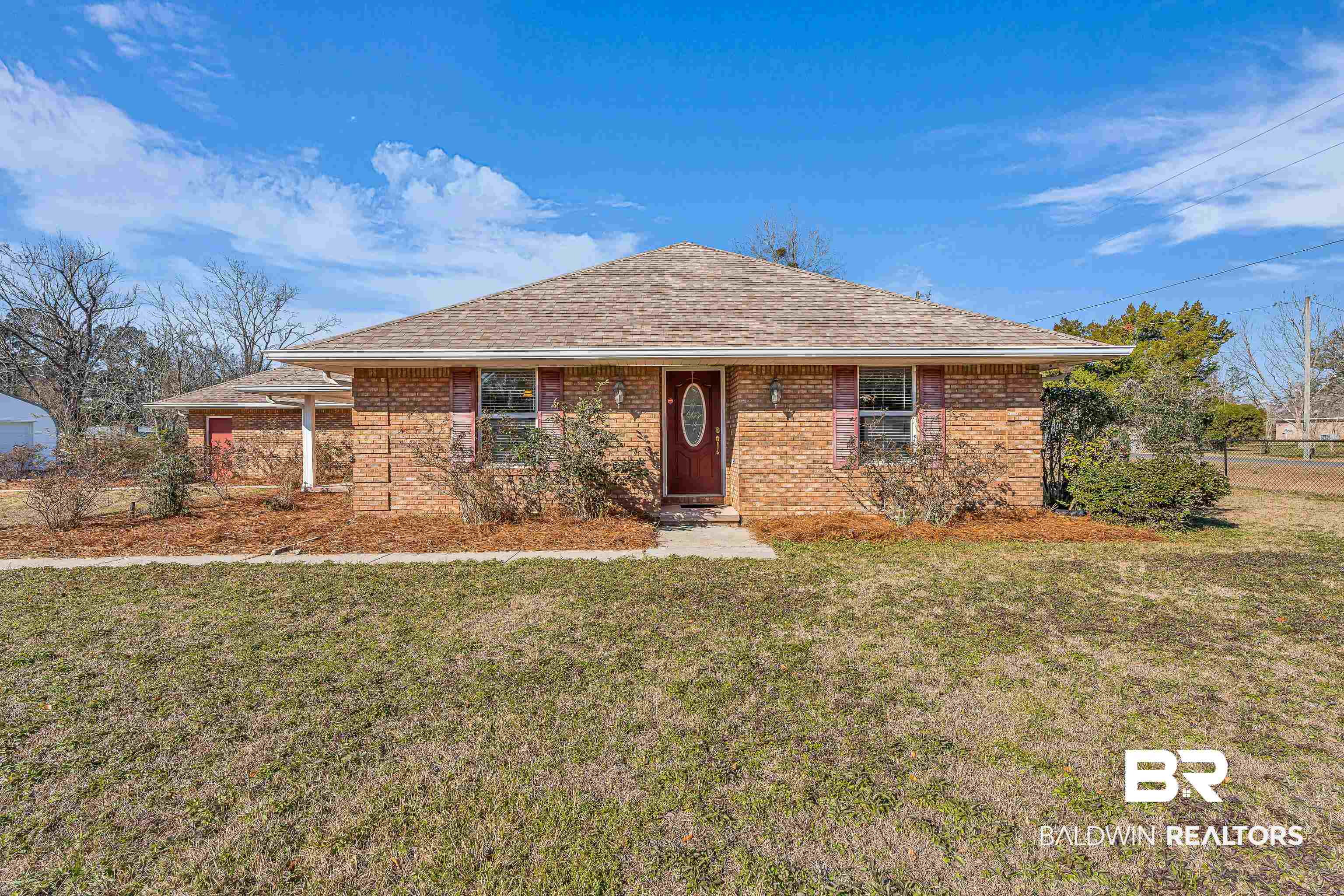 22095 8th Street Silverhill, AL 36576 - Photo 8 of 42 Ranch-style house featuring a front yard, brick siding, and roof with shingles