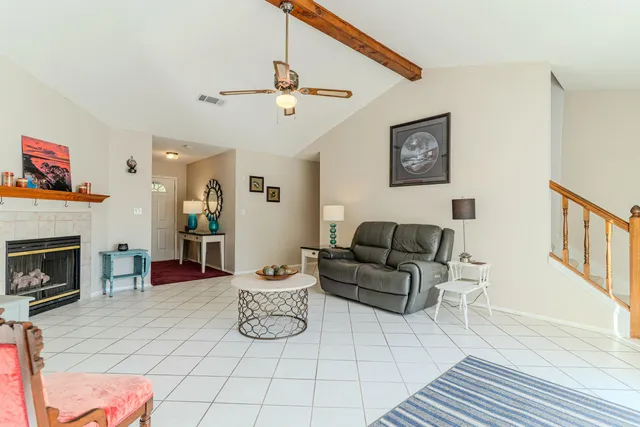 a kitchen with stainless steel appliances granite countertop a refrigerator a stove top oven a sink and dishwasher