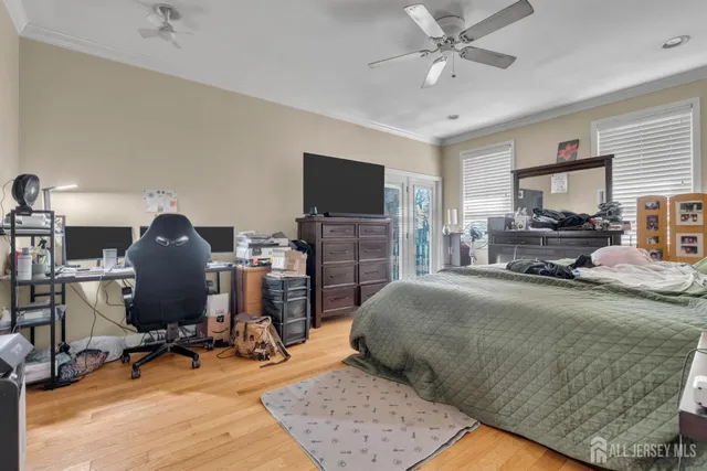 a bedroom with a bed a desk and chair