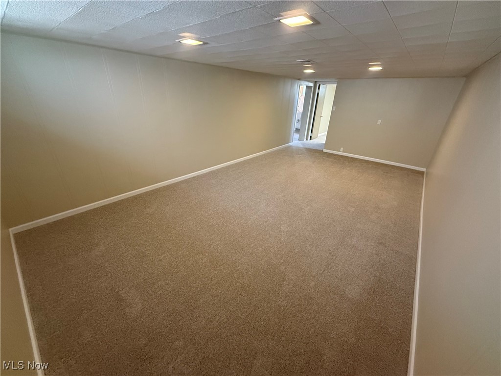 9417 Alexander Road Garfield Heights, OH 44125 - Photo 29 of 38 Finished below grade area with baseboards and carpet floors
