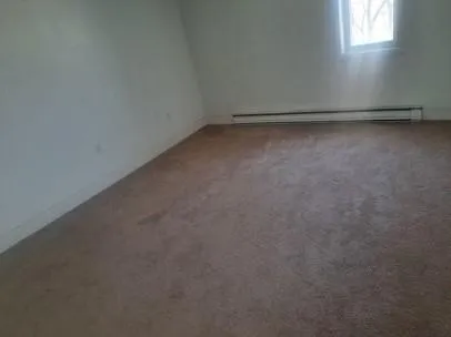 a view of a room with an empty space