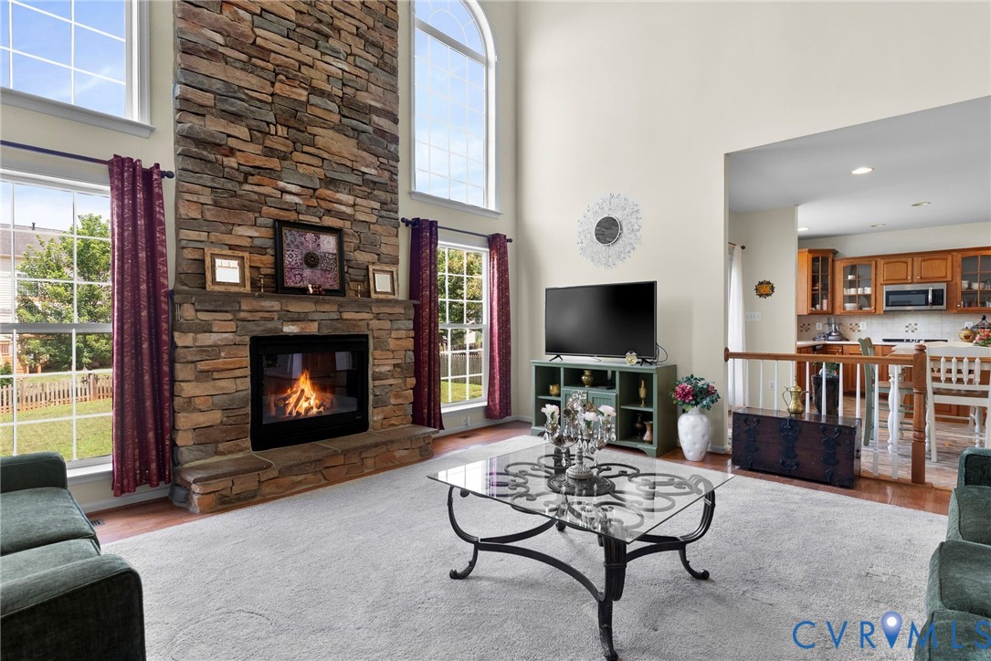 753 Blossom Tree Road Culpeper, VA 22701 - Photo 16 of 68 Two-story living area featuring a stone-clad firep