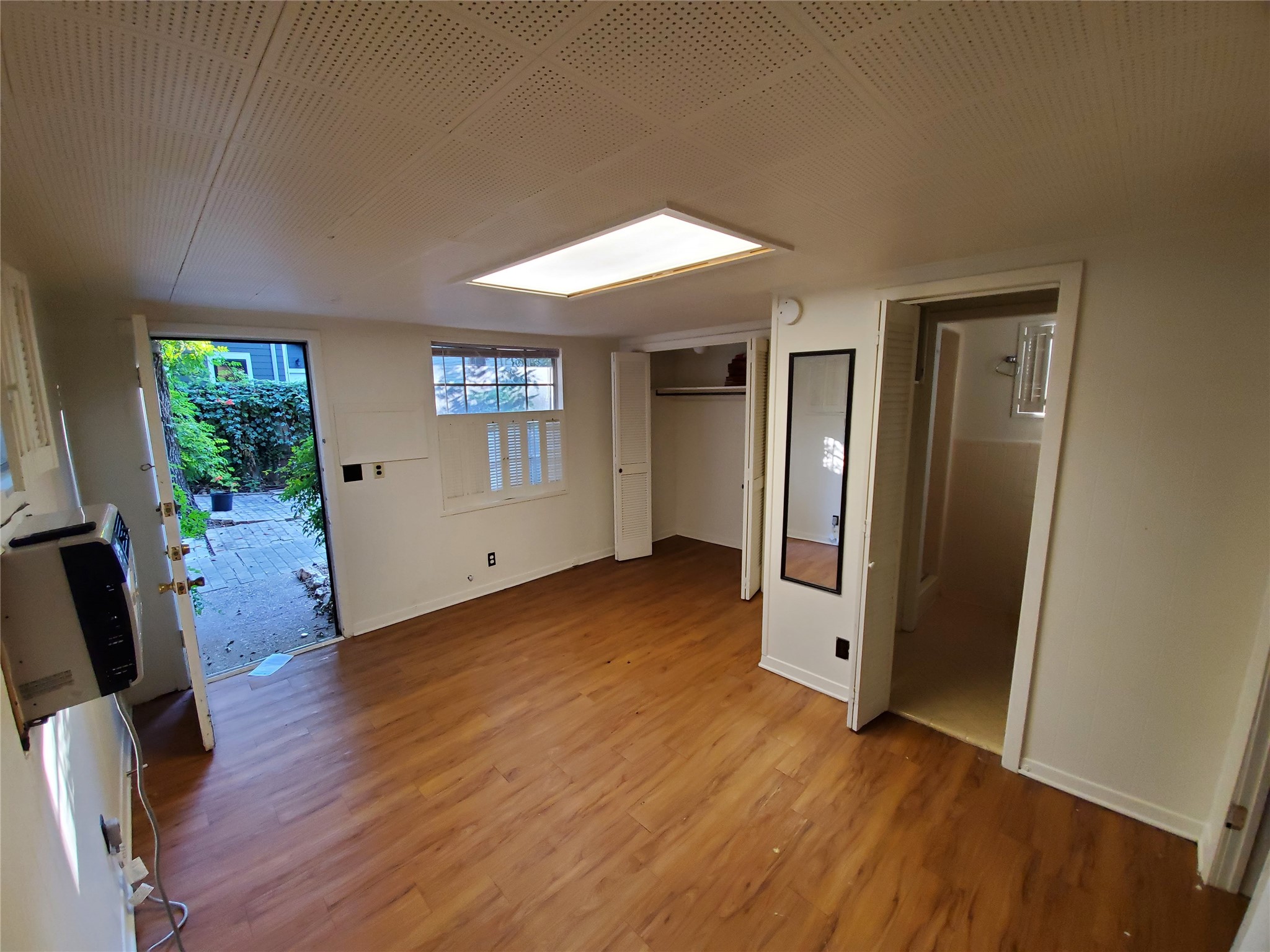 4113 Speedway Austin, TX 78751 - Photo 27 of 31 Rich wood-toned flooring anchors this flexible living space opening directly to a private outdoor patio.