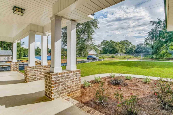 a view of a swimming pool with a patio
