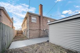 9209 South State Street Chicago, IL 60619 - Photo 19 of 20 a front view of a house with a garage