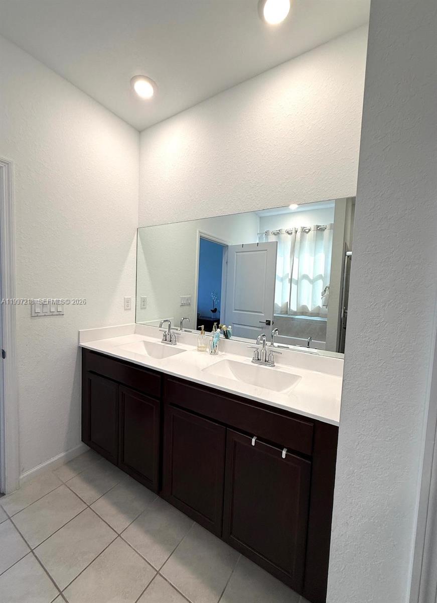 13233 Southwest 272nd Street Homestead, FL 33032 - Photo 15 of 21 a bathroom with a double vanity sink and mirror